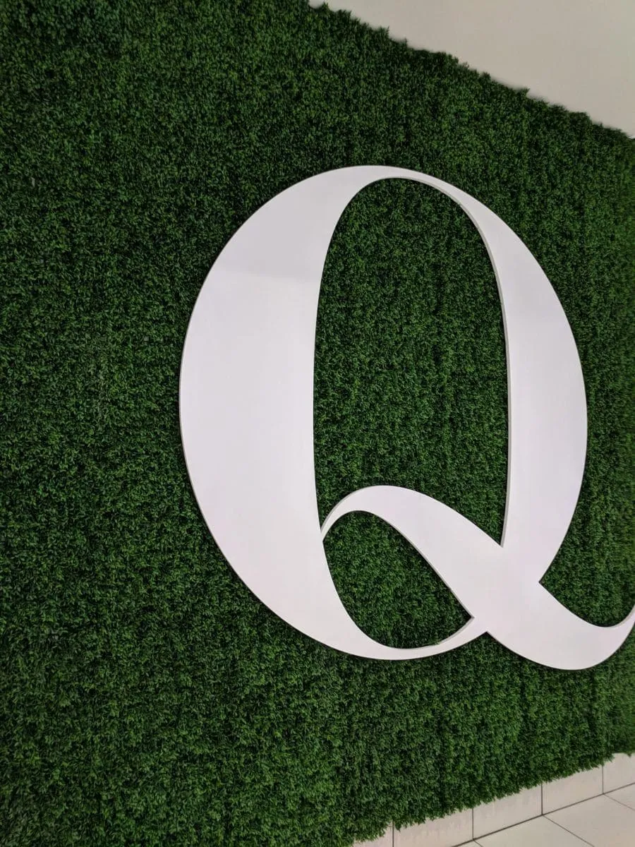 Fake green wall backdrop for logo